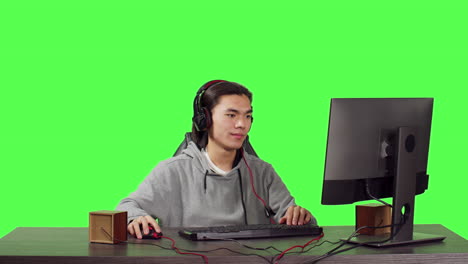 Asian-player-on-computer-at-pc